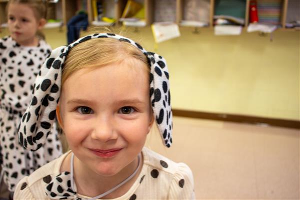 girl dressed as dalmatian dog with long ears